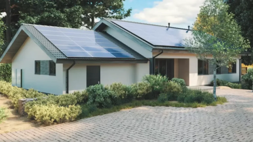 Vivienda unifamiliar con paneles solares visibles en tejado, representando el perfil de hogar tipo para el que la batería virtual genera más beneficio económico que la batería física